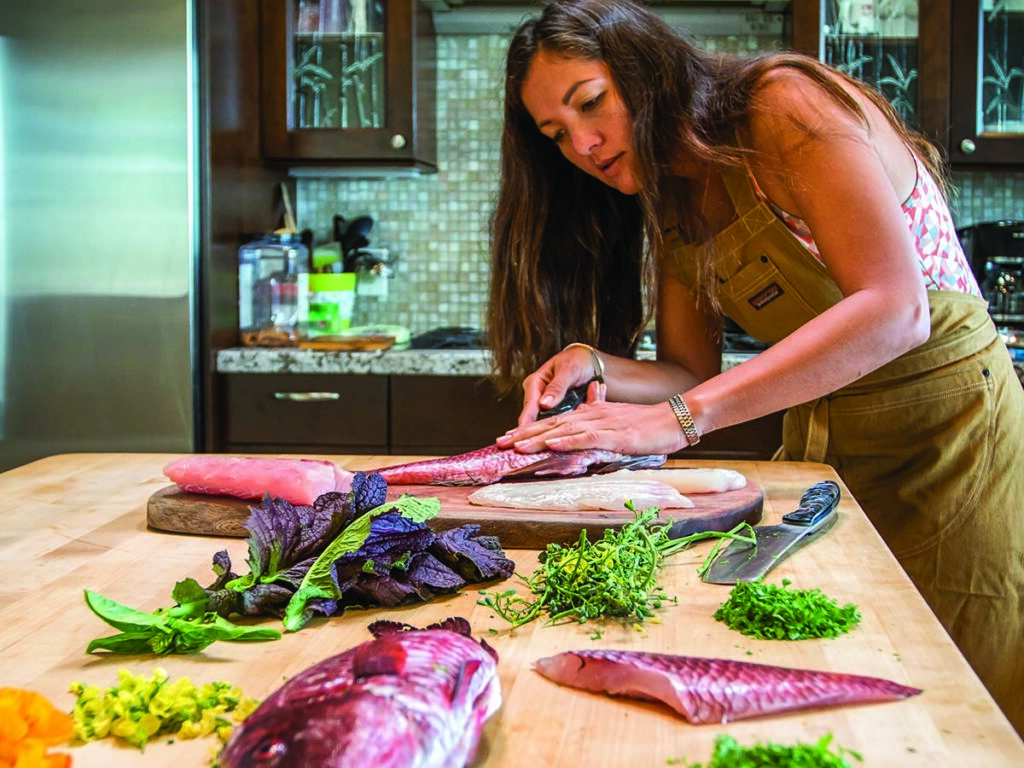 Kimi Werner preparing a meal.
