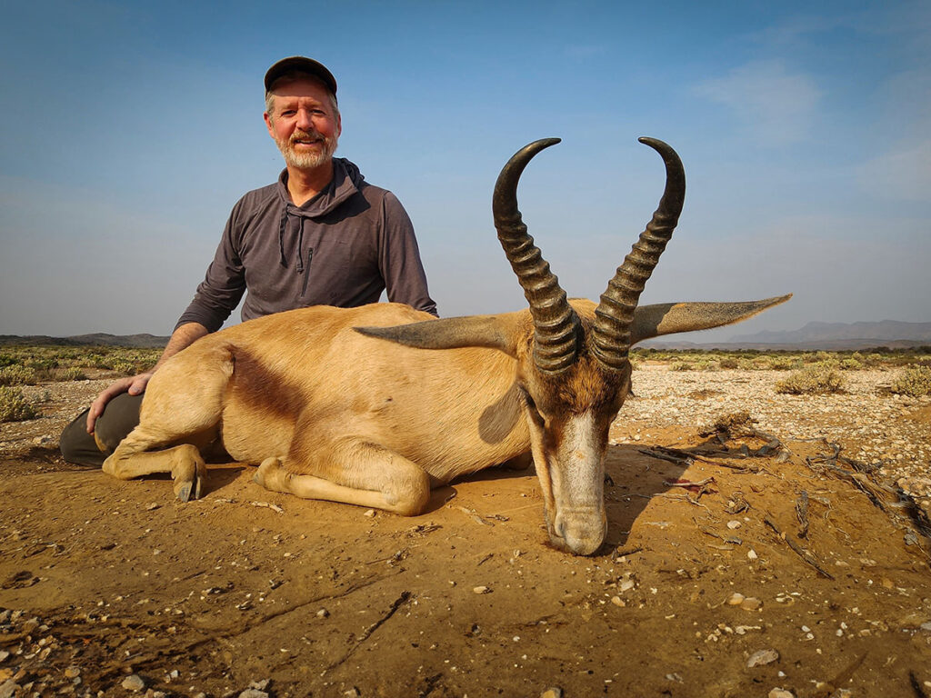 Jon Wayne Taylor posing next to his freshly taken Copper Springbok.